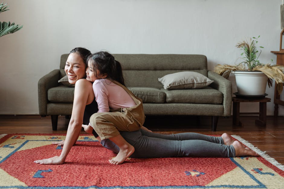 Woman smiling peacefully while doing a gentle seated yoga stretch at home.